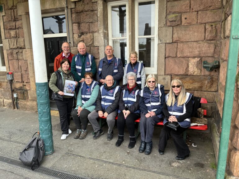 Friends of Helsby Station volunteers with representatives from North Cheshire Community Rail Partnership and Transport for Wales at Helsby Station