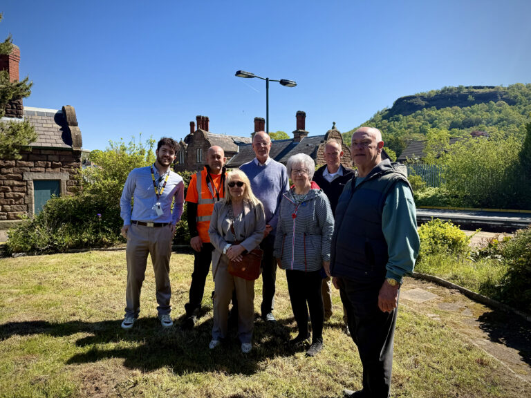 Group of partners and volunteers at Helsby Station during community rail site visit
